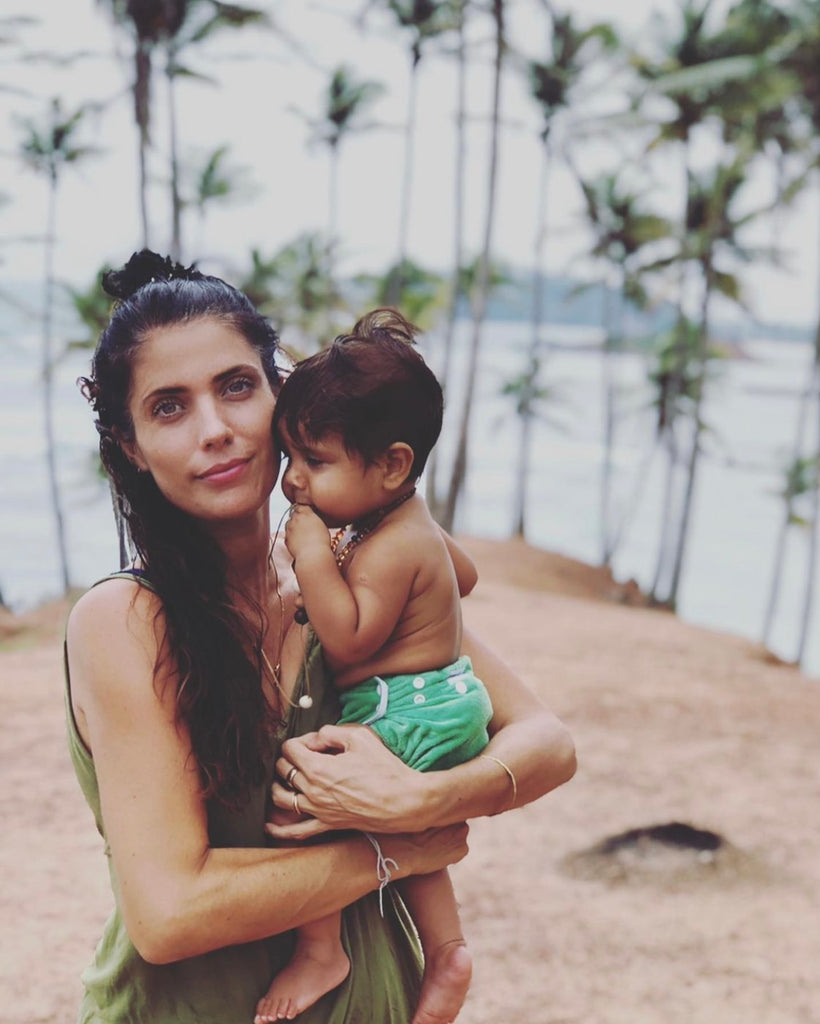 Little Koko owner Hayley Marakkalamana with a baby, in Mirissa Sri Lanka