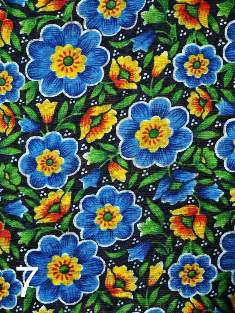 large blue flowers and little yellow flowers on black fabric for little koko not-for-profit gift bags
