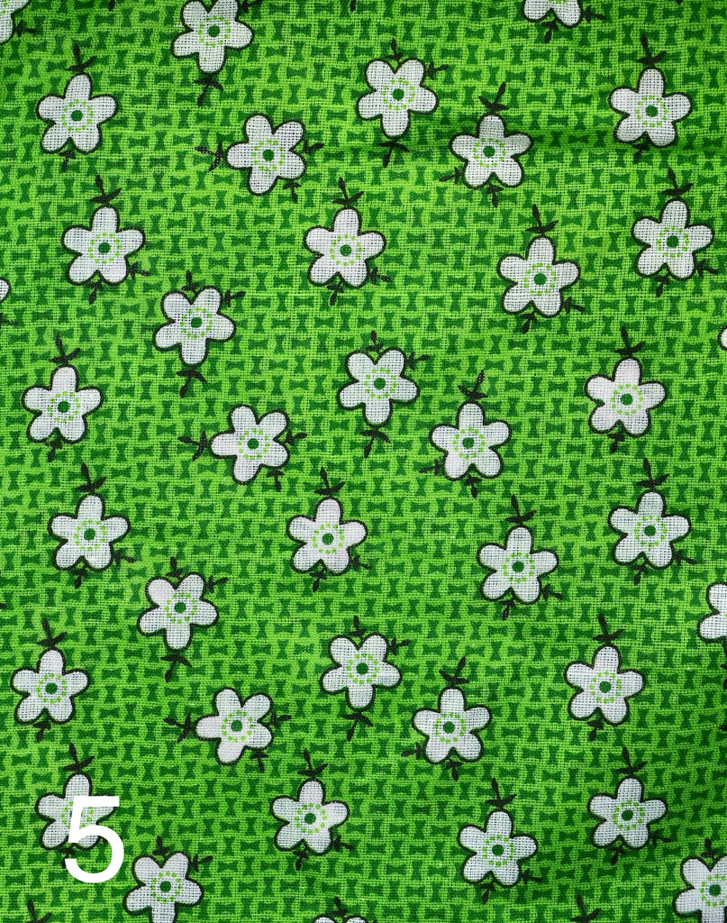 white flowers on green fabric for little koko not-for-profit gift bags