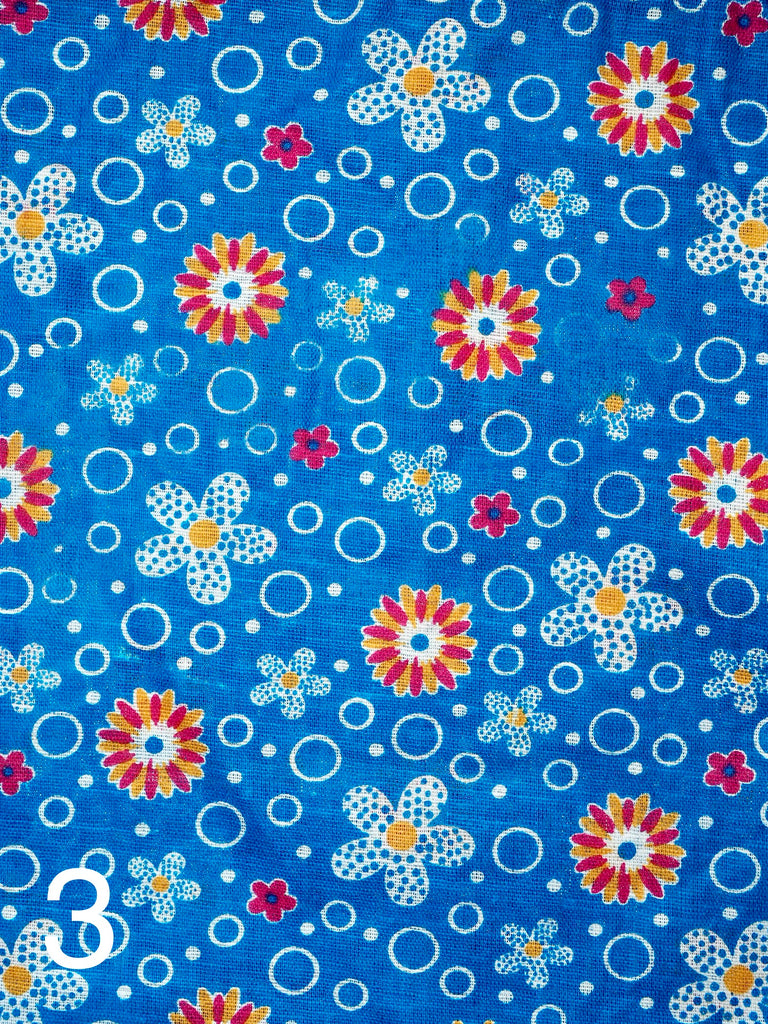 pink, yellow  and white flowers on blue fabric for little koko not-for-profit gift bags