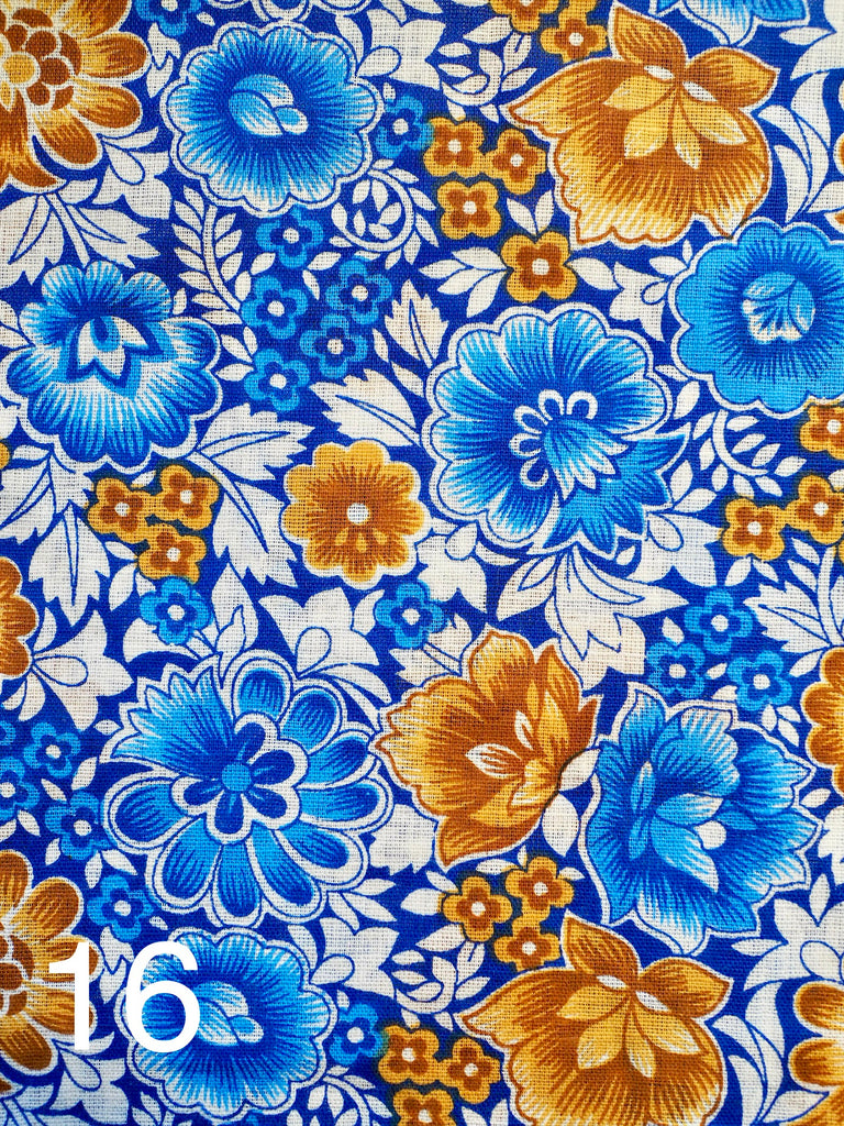 a beautiful orange and blue floral design on blue fabric for little koko not-for-profit gift bags