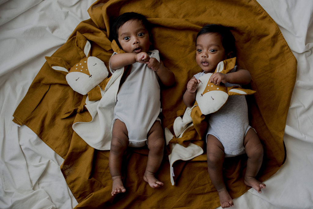 twin babies relaxing with little koko deer comforters